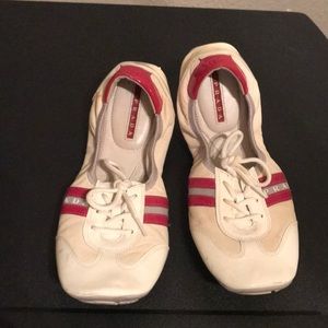 Red and white Prada tennis shoe